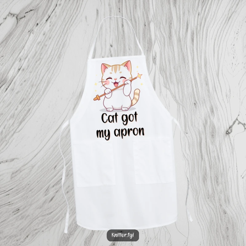 Funny apron with a playful cat character enthusiastically threading a giant, sparkling needle, perfect for kitchen or craft fun.