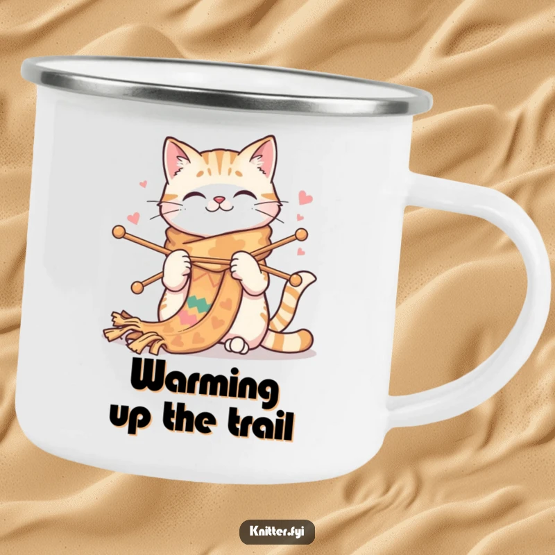 Funny cat camping mug showing a happy cat knitting a very long, colorful scarf with large needles. Durable and humorous.