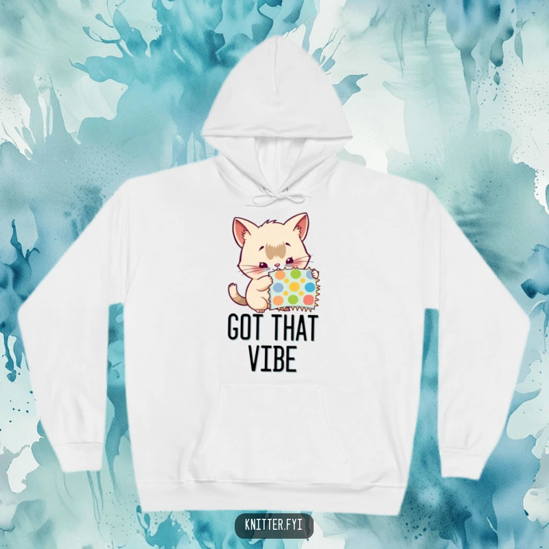 Funny hoodie: A creature with actively twitching whiskers carefully examines a colorful pattern swatch, showing detailed observation.