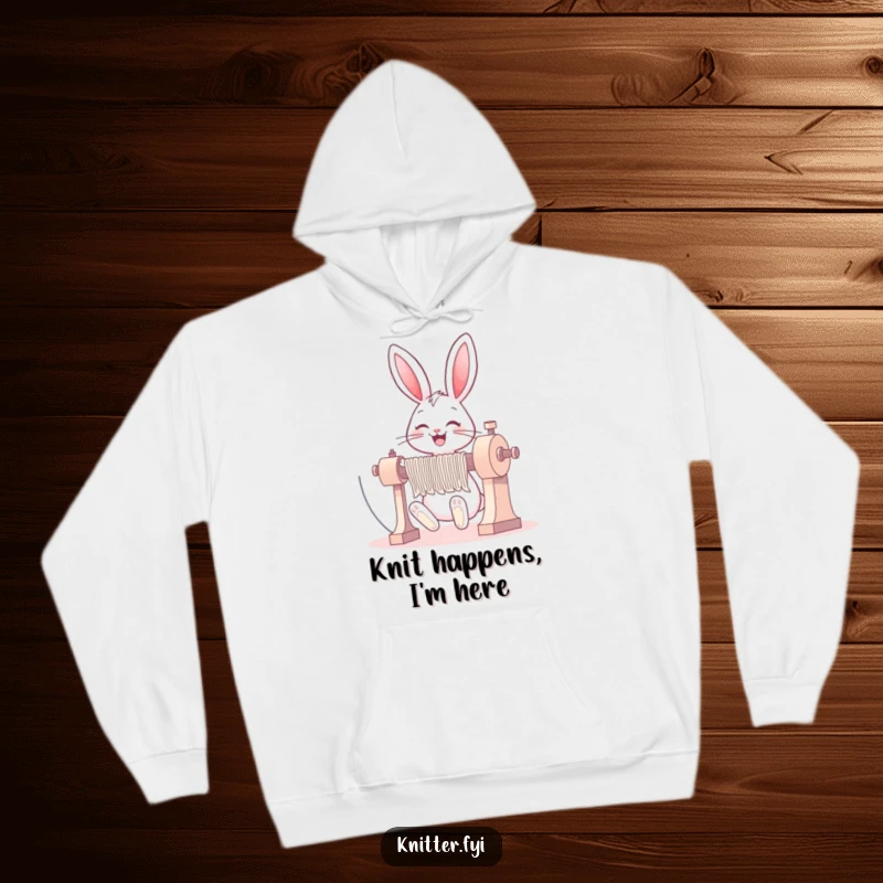 Funny bunny hoodie with a happy rabbit operating a large knitting machine, exuding joy and skill.