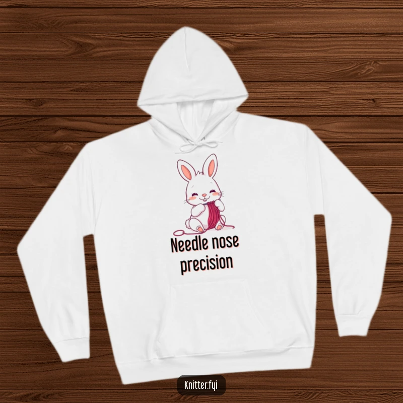 Funny cheerful rabbit hoodie threading a needle, a cozy and humorous apparel item, perfect for crafters.