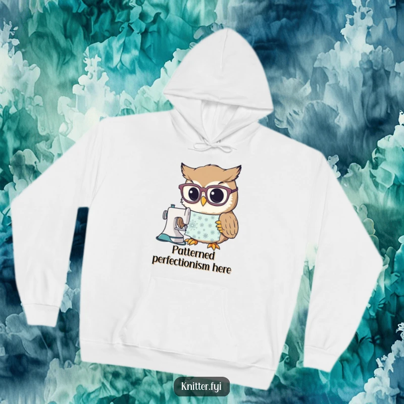 Funny hoodie with a curious owl character donning large spectacles to study an intricate sewing pattern, perfect for cozy crafting sessions.