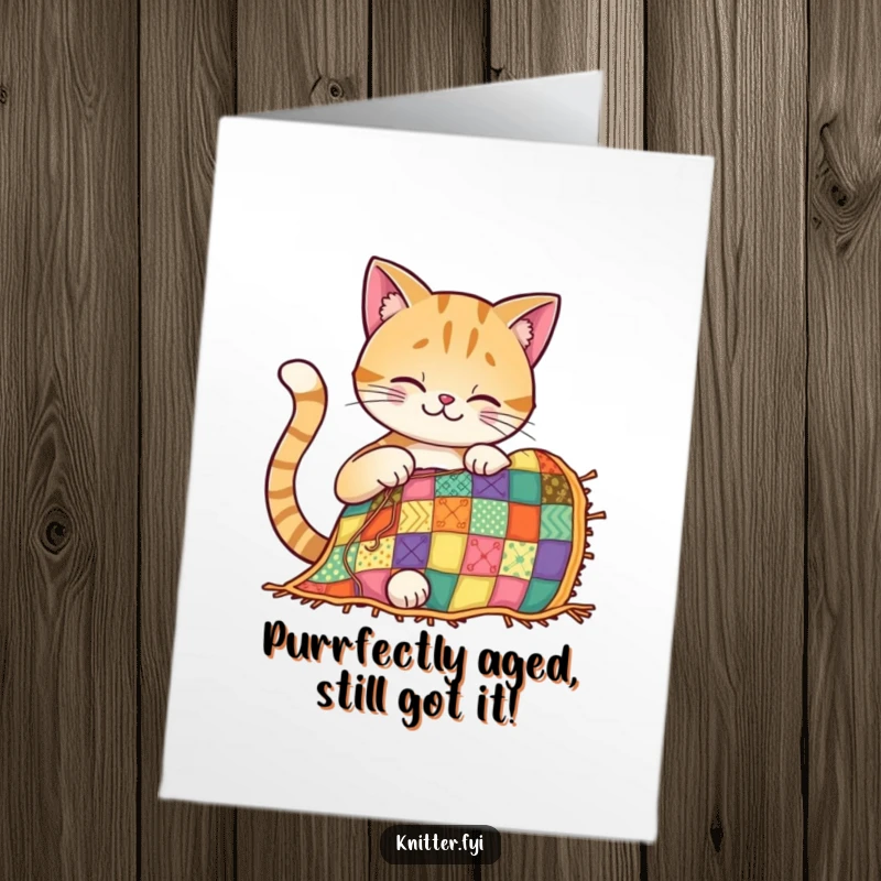 Funny Free Printable Birthday Card: A smiling cat intently stitches a colorful patchwork quilt, radiating joy.