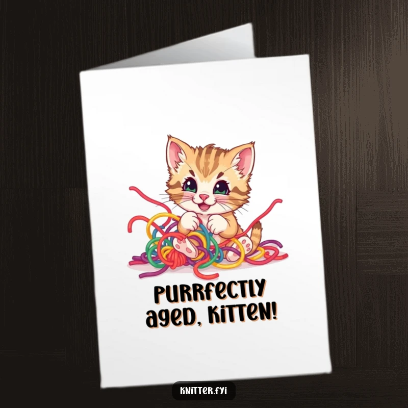 Funny Free Printable Birthday Card of a playful kitten happily tangled in colorful yarn, looking mischievous.