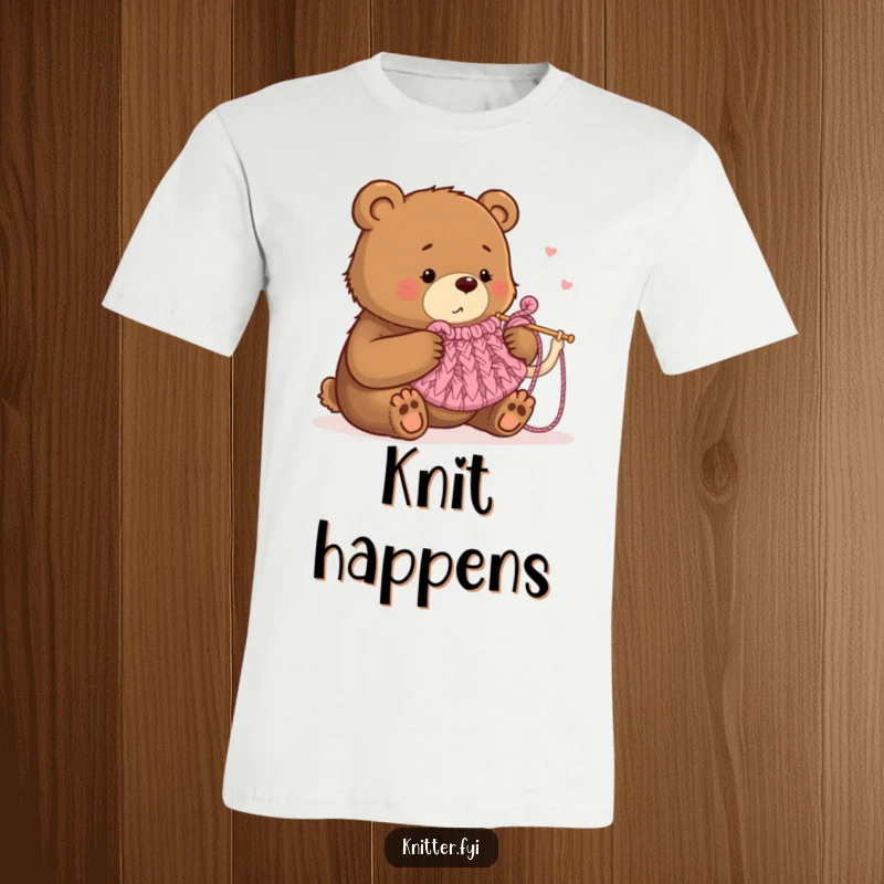 Funny t-shirt with a determined bear humorously attempting to knit a tiny tea cozy with large needles, perfect for crafters.