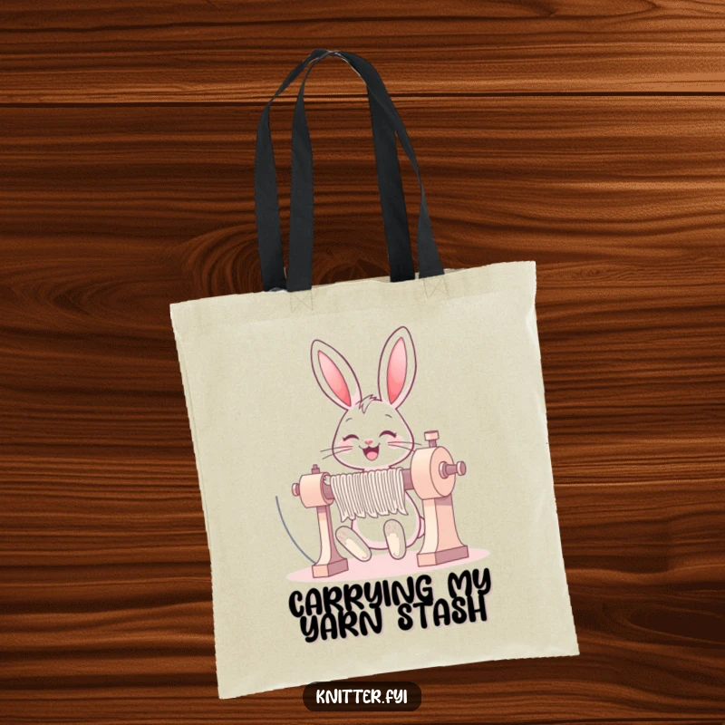 Funny bunny tote bag showing a happy rabbit grinning while operating a large knitting machine enthusiastically.