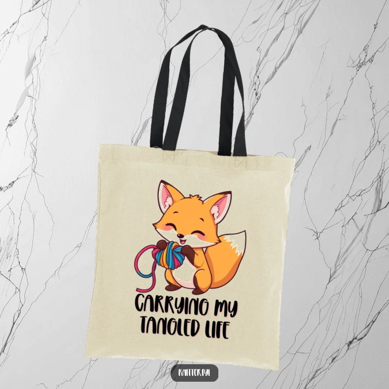 Funny tote bag displaying a mischievous fox character engrossed in playfully tangling colorful yarn into a complex knot, great for craft enthusiasts.